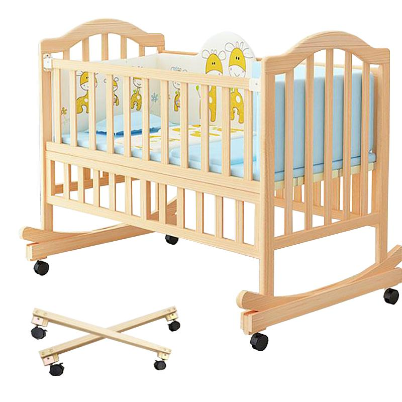 A Classic Solid Wood Baby Cradle With Wheels