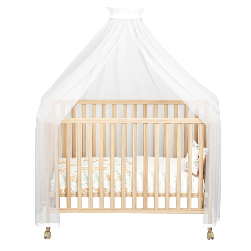 A Classic Natural Baby Wood Crib With Wheels